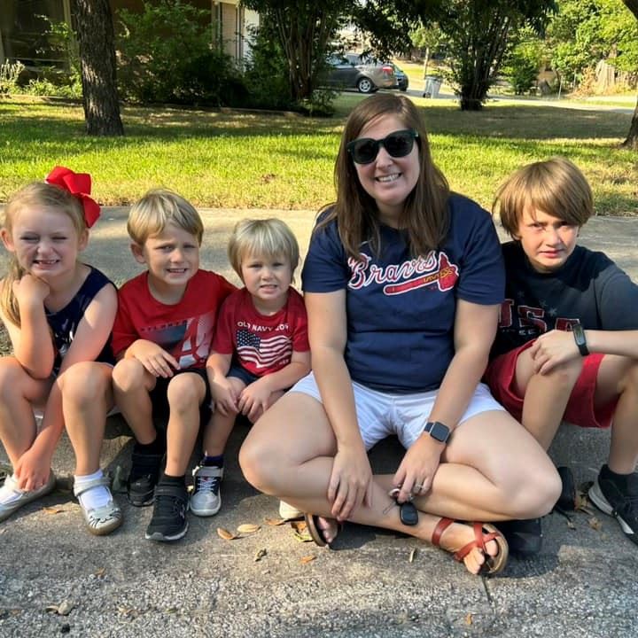 Family watching July Fourth parade